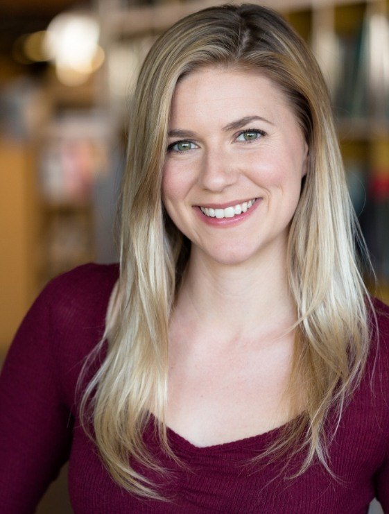 Blonde woman smiling after visiting cosmetic dental and facial treatment office in Dallas