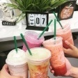 Group of people toasting with their iced coffee drinks