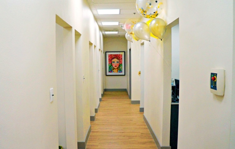 Hallway leading to several dental treatment rooms