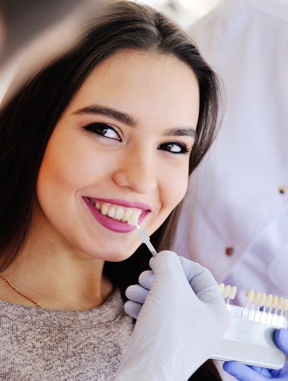 Woman in dental chair getting dental veneers in Dallas